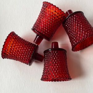 Red hobnail glass candlestick holders for small tea candles. Very old